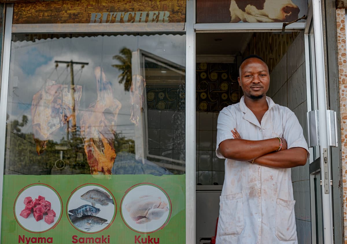 Independent shop owner outside his storefront